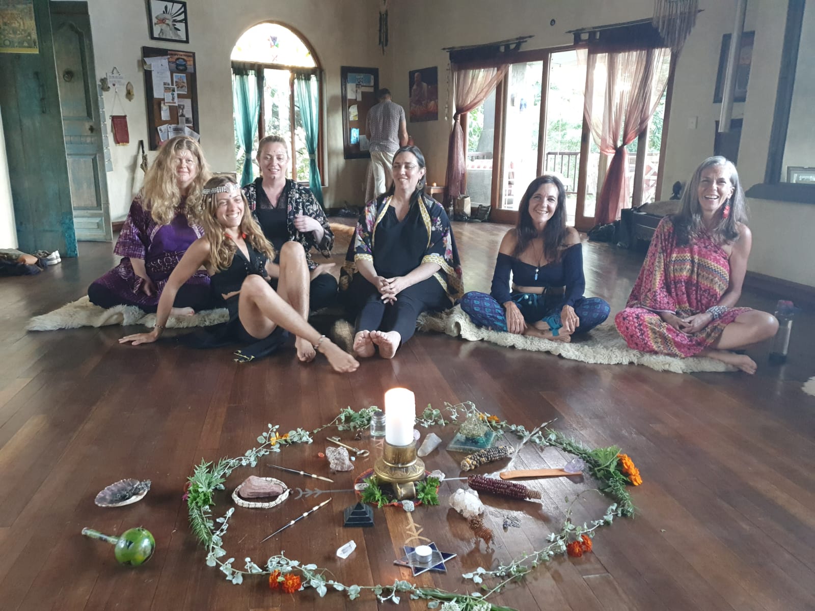 Retreat participants in nature setting during healing ceremony